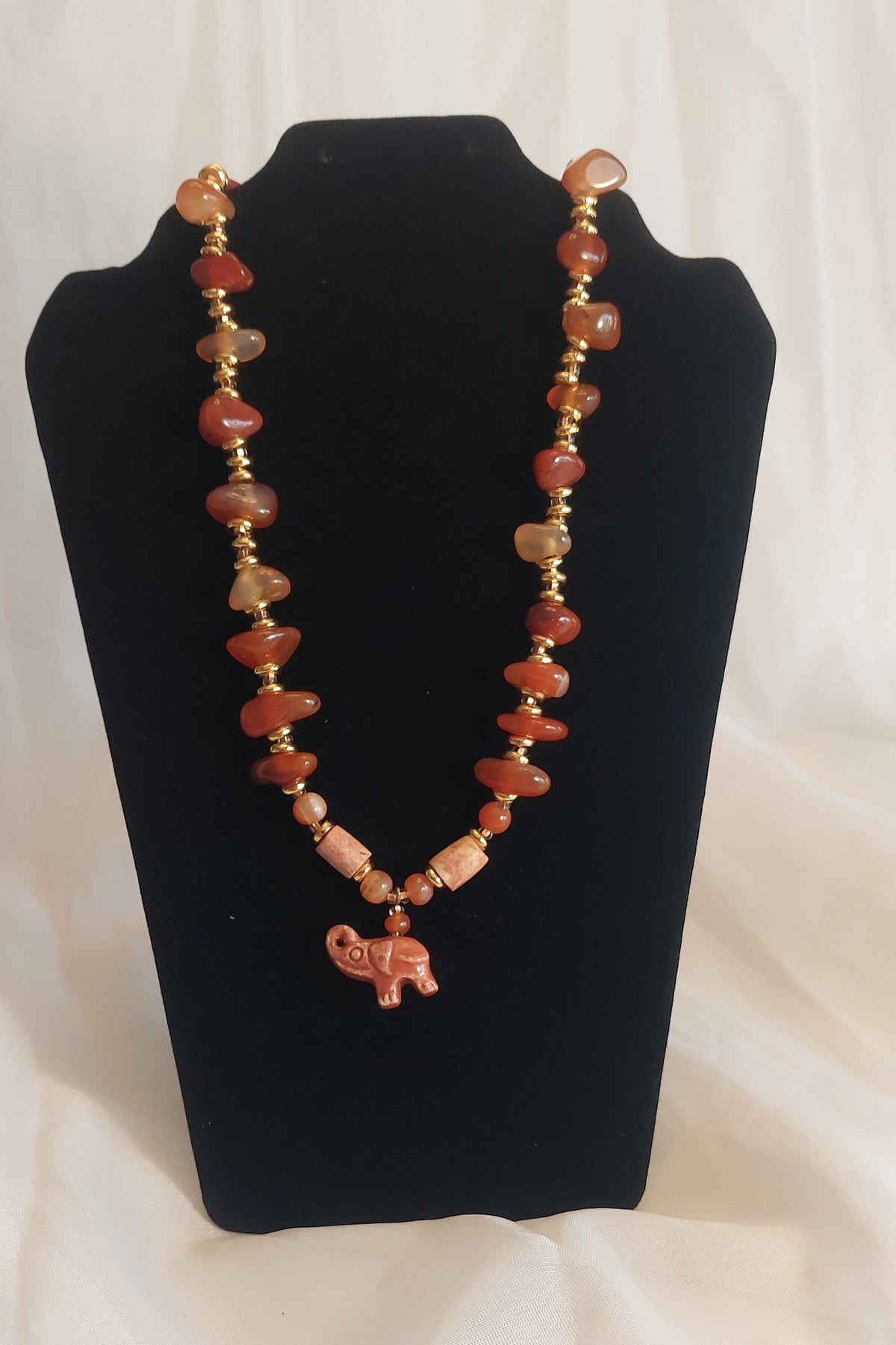 Gemstone and elephant nec