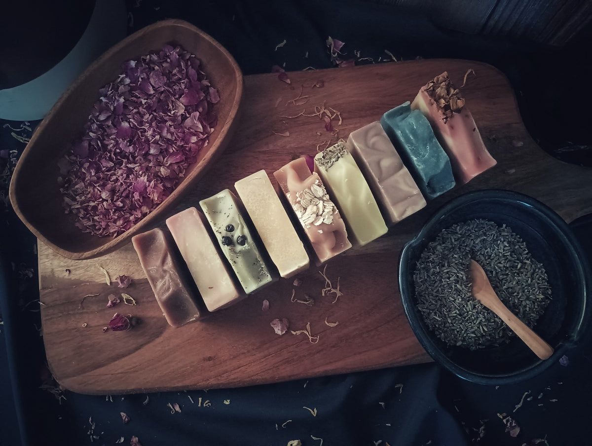 Goat Milk Soap with bowl of rose buds and lavender buds